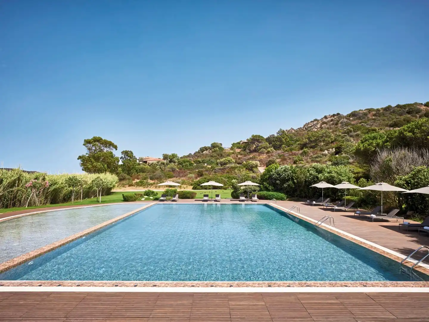 Baia di Chia Resort Sardinia, Curio Collection by Hilton Pool